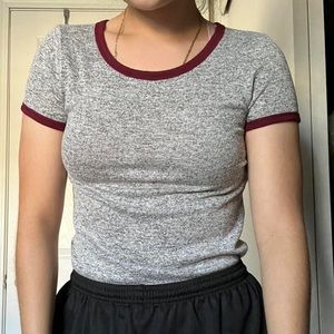 Heathered grey top with burgundy hem